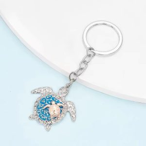Silberne Schildkröte mit weissen und blauen Steinen, ca 3 cm, mit Babyschildkröte